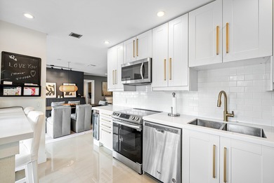 Beautifully updated 2nd-floor residence featuring bold color on Quail Ridge Golf Course and Country Club in Florida - for sale on GolfHomes.com, golf home, golf lot