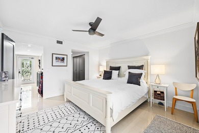 Beautifully updated 2nd-floor residence featuring bold color on Quail Ridge Golf Course and Country Club in Florida - for sale on GolfHomes.com, golf home, golf lot