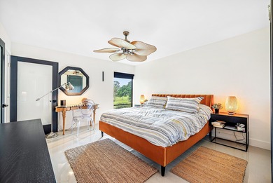 Beautifully updated 2nd-floor residence featuring bold color on Quail Ridge Golf Course and Country Club in Florida - for sale on GolfHomes.com, golf home, golf lot