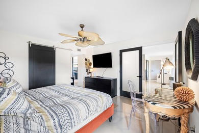 Beautifully updated 2nd-floor residence featuring bold color on Quail Ridge Golf Course and Country Club in Florida - for sale on GolfHomes.com, golf home, golf lot