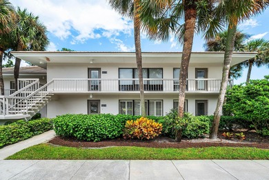 Beautifully updated 2nd-floor residence featuring bold color on Quail Ridge Golf Course and Country Club in Florida - for sale on GolfHomes.com, golf home, golf lot