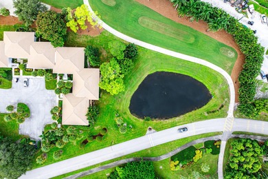 Beautifully updated 2nd-floor residence featuring bold color on Quail Ridge Golf Course and Country Club in Florida - for sale on GolfHomes.com, golf home, golf lot