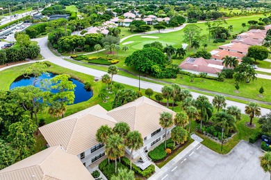 Beautifully updated 2nd-floor residence featuring bold color on Quail Ridge Golf Course and Country Club in Florida - for sale on GolfHomes.com, golf home, golf lot