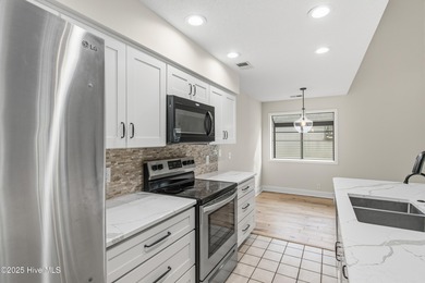 This golf-front, Clubhouse Villa in the vibrant community of Sea on Sea Trail Golf Resort in North Carolina - for sale on GolfHomes.com, golf home, golf lot