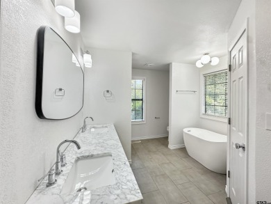 Welcome to 401 Hideaway Ln E -- a fully refreshed 3-bedroom on Hide-A-Way Lake Golf Course in Texas - for sale on GolfHomes.com, golf home, golf lot