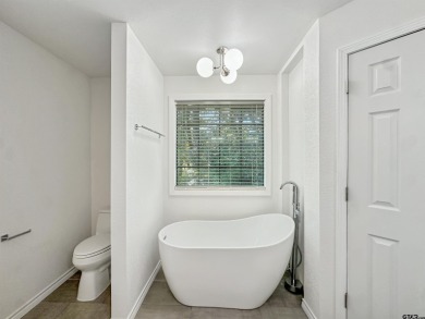 Welcome to 401 Hideaway Ln E -- a fully refreshed 3-bedroom on Hide-A-Way Lake Golf Course in Texas - for sale on GolfHomes.com, golf home, golf lot