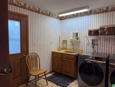 Let's take a look at 841 Country Club Dr. in Akron Iowa that's on Akron Golf Course in Iowa - for sale on GolfHomes.com, golf home, golf lot
