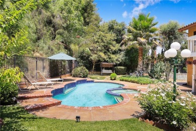 Nestled in West Covina's prestigious South Hills neighborhood on South Hills Country Club in California - for sale on GolfHomes.com, golf home, golf lot