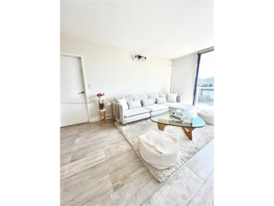 Step into this tastefully renovated 2-bedroom, 2-bath residence on Turnberry Isle Resort and Club in Florida - for sale on GolfHomes.com, golf home, golf lot
