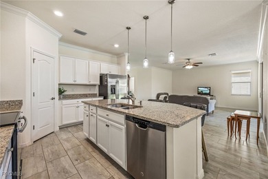 LIKE-NEW Roma Model home offering a bright, OPEN-CONCEPT DESIGN on Pelican Preserve Golf Club in Florida - for sale on GolfHomes.com, golf home, golf lot