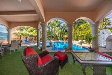 Villa Maravilla is a beautifully crafted golf-front residence on Club De Golf Puerto Aventuras in  - for sale on GolfHomes.com, golf home, golf lot