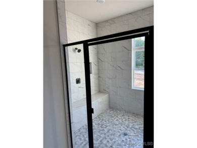 This meticulously crafted 2025 Genesis 2 model home boasts 3 on Southern Woods Golf Club in Florida - for sale on GolfHomes.com, golf home, golf lot