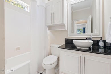 Easy to enjoy this custom built 5BR/4BA home on the lake with on LeTriomphe Golf and Country Club in Louisiana - for sale on GolfHomes.com, golf home, golf lot