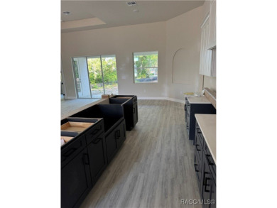 This meticulously crafted 2025 Genesis 2 model home boasts 3 on Southern Woods Golf Club in Florida - for sale on GolfHomes.com, golf home, golf lot