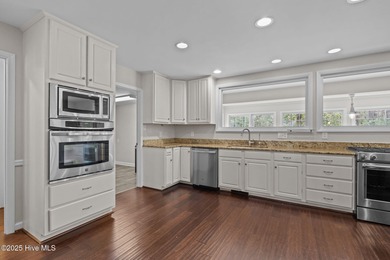 Nestled among mature trees in one of Morehead City's most on Brandywine Bay Golf Club in North Carolina - for sale on GolfHomes.com, golf home, golf lot