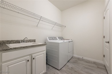 LIKE-NEW Roma Model home offering a bright, OPEN-CONCEPT DESIGN on Pelican Preserve Golf Club in Florida - for sale on GolfHomes.com, golf home, golf lot