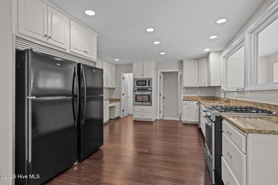 Nestled among mature trees in one of Morehead City's most on Brandywine Bay Golf Club in North Carolina - for sale on GolfHomes.com, golf home, golf lot