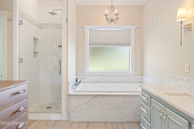 Easy to enjoy this custom built 5BR/4BA home on the lake with on LeTriomphe Golf and Country Club in Louisiana - for sale on GolfHomes.com, golf home, golf lot