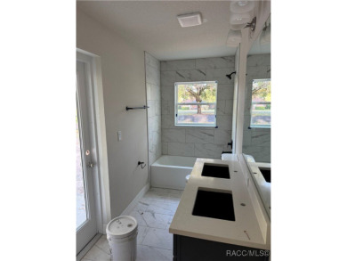 This meticulously crafted 2025 Genesis 2 model home boasts 3 on Southern Woods Golf Club in Florida - for sale on GolfHomes.com, golf home, golf lot