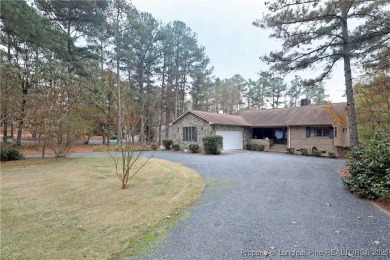Golf-front living at its finest! This beautiful single-story on Woodlake Country Club in North Carolina - for sale on GolfHomes.com, golf home, golf lot
