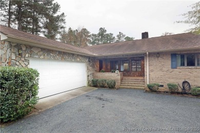 Golf-front living at its finest! This beautiful single-story on Woodlake Country Club in North Carolina - for sale on GolfHomes.com, golf home, golf lot