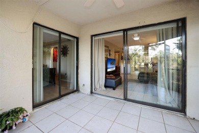 Looking for a 2 bedroom 2 bath 1st floor end unit condo? Well on East Lake Woodlands Country Club in Florida - for sale on GolfHomes.com, golf home, golf lot