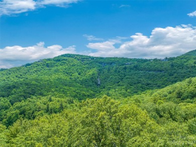 Set on a gentle knoll above Lake Toxaway, this prime lot on Lake Toxaway Country Club in North Carolina - for sale on GolfHomes.com, golf home, golf lot