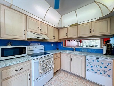 ***MOTIVATED SELLER*** Beautiful Condo Overlooking Isla Del Sol on Isla Del Sol Yacht and Country Club in Florida - for sale on GolfHomes.com, golf home, golf lot