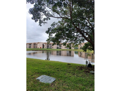 Waterfront/golf course view from your Sunrise Lakes Phase 4 on Sunrise Lakes Phase IV Golf Course in Florida - for sale on GolfHomes.com, golf home, golf lot