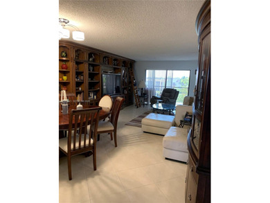 Waterfront/golf course view from your Sunrise Lakes Phase 4 on Sunrise Lakes Phase IV Golf Course in Florida - for sale on GolfHomes.com, golf home, golf lot