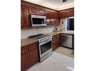 Waterfront/golf course view from your Sunrise Lakes Phase 4 on Sunrise Lakes Phase IV Golf Course in Florida - for sale on GolfHomes.com, golf home, golf lot