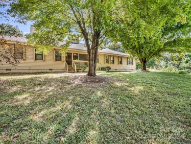 Charming 2 bed, 2 bath home offering main-level living and a on Asheville Municipal Golf Course in North Carolina - for sale on GolfHomes.com, golf home, golf lot