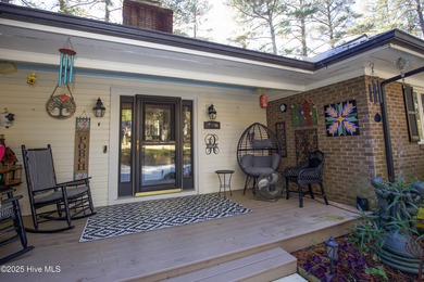 Perfectly positioned on a dog-leg right par five of the Seven on Seven Lakes Country Club in North Carolina - for sale on GolfHomes.com, golf home, golf lot