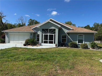 This beautiful custom home features three bedrooms and a on Citrus Springs Country Club in Florida - for sale on GolfHomes.com, golf home, golf lot