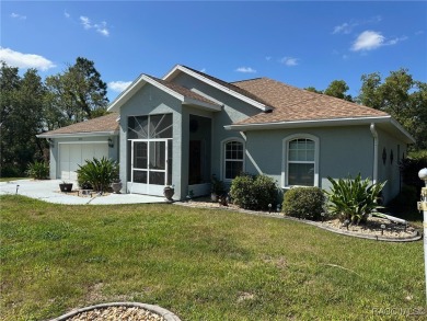 This beautiful custom home features three bedrooms and a on Citrus Springs Country Club in Florida - for sale on GolfHomes.com, golf home, golf lot