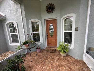 This beautiful custom home features three bedrooms and a on Citrus Springs Country Club in Florida - for sale on GolfHomes.com, golf home, golf lot