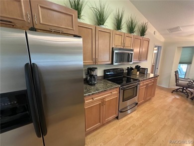 This beautiful custom home features three bedrooms and a on Citrus Springs Country Club in Florida - for sale on GolfHomes.com, golf home, golf lot