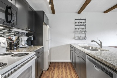 Amazing fully furnished condo with excellent rental history in on Crystal Mountain Golf Course in Michigan - for sale on GolfHomes.com, golf home, golf lot