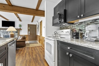 Amazing fully furnished condo with excellent rental history in on Crystal Mountain Golf Course in Michigan - for sale on GolfHomes.com, golf home, golf lot
