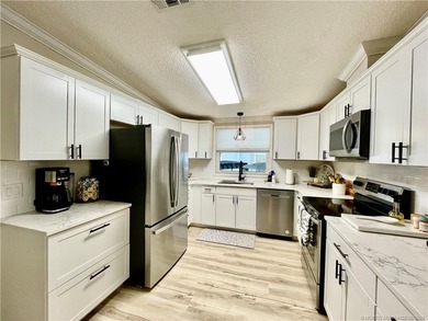 This gorgeous home was completely remodeled in 2023. THIS IS A on Indianwood Golf and Country Club in Florida - for sale on GolfHomes.com, golf home, golf lot