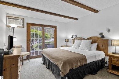 Amazing fully furnished condo with excellent rental history in on Crystal Mountain Golf Course in Michigan - for sale on GolfHomes.com, golf home, golf lot