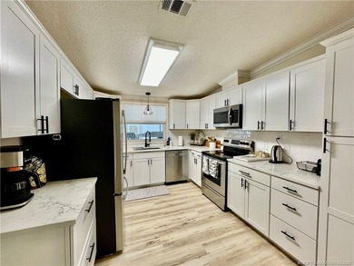 This gorgeous home was completely remodeled in 2023. THIS IS A on Indianwood Golf and Country Club in Florida - for sale on GolfHomes.com, golf home, golf lot