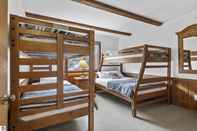 Amazing fully furnished condo with excellent rental history in on Crystal Mountain Golf Course in Michigan - for sale on GolfHomes.com, golf home, golf lot