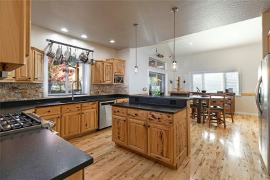 Welcome to this well-cared for 5-bedroom, 3.5-bathroom home in on The Highlands Golf Club in Montana - for sale on GolfHomes.com, golf home, golf lot