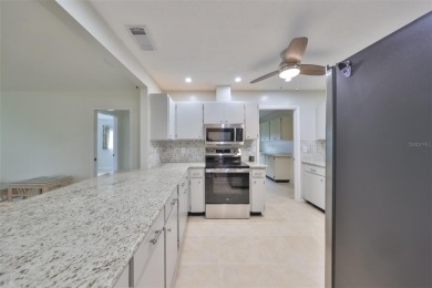 Under contract-accepting backup offers. One or more photo(s) has on Caloosa Greens Executive Golf Course in Florida - for sale on GolfHomes.com, golf home, golf lot