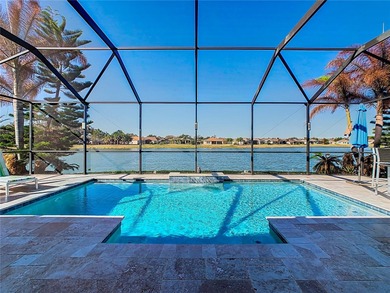 STUNNING & SPOTLESS CABELLA model with a heated Salt Water POOL on Stonegate Golf Club in Florida - for sale on GolfHomes.com, golf home, golf lot