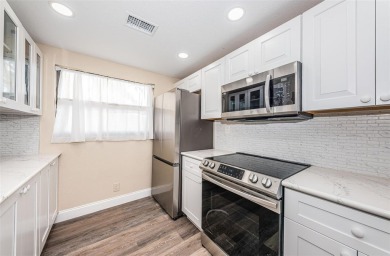 Great value in this beautifully renovated ground floor villa on Isla Del Sol Yacht and Country Club in Florida - for sale on GolfHomes.com, golf home, golf lot