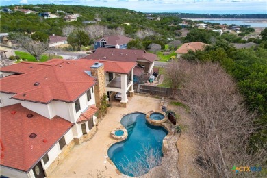 This luxurious Mediterranean-style home boasts of views of Lake on Highland Lakes Golf Course in Texas - for sale on GolfHomes.com, golf home, golf lot