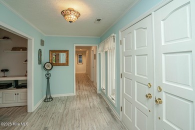 Spacious Coastal Retreat with Sunroom & Outdoor Entertaining on Brick Landing Plantation Yacht and Golf Club in North Carolina - for sale on GolfHomes.com, golf home, golf lot