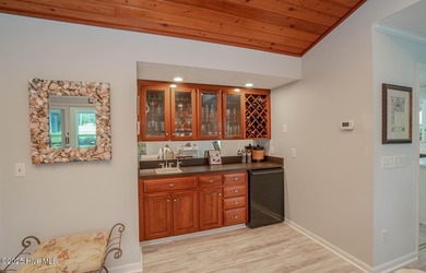 Spacious Coastal Retreat with Sunroom & Outdoor Entertaining on Brick Landing Plantation Yacht and Golf Club in North Carolina - for sale on GolfHomes.com, golf home, golf lot